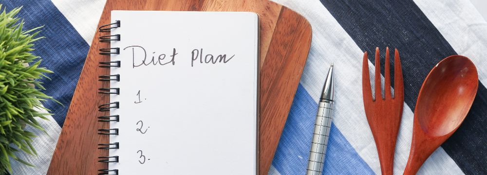 Blank diet plan journal sits ready to start a new nutrition plan after weight loss surgery in Alabama